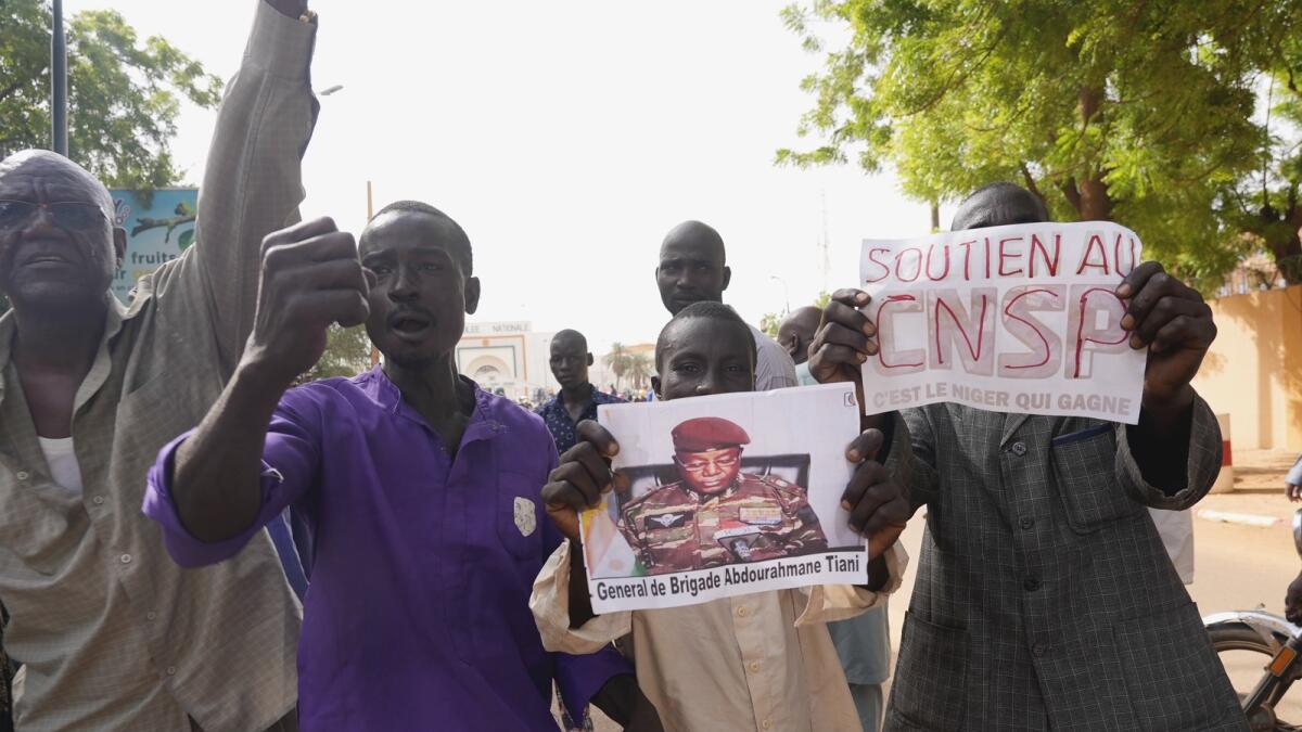 Nigeriens participate in a march called by supporters of coup leader Gen. Abdourahmane Tchiani. — AP
