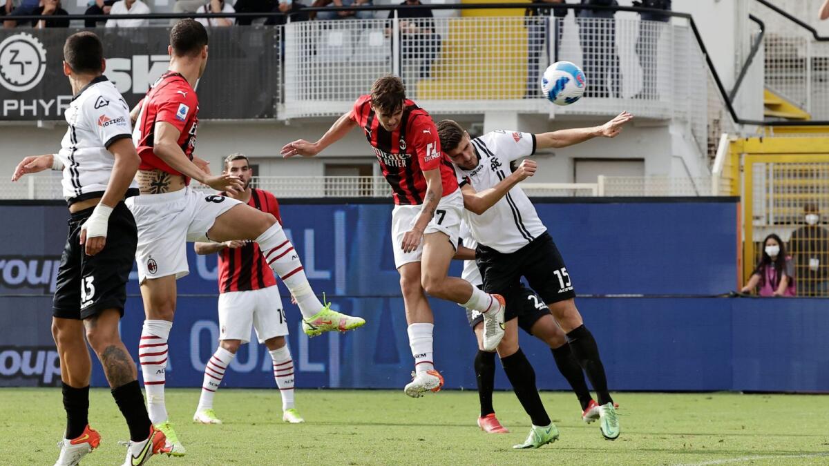 AC Milan’s Daniel Maldini (second from right) heads home against Spezia in the Serie A on Saturday. — Reuters