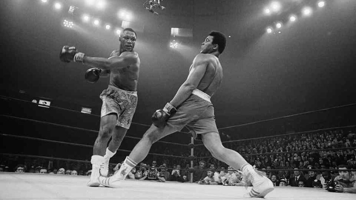 Muhammad Ali and Joe Frazier fought for the third time in Manila. -- Twitter