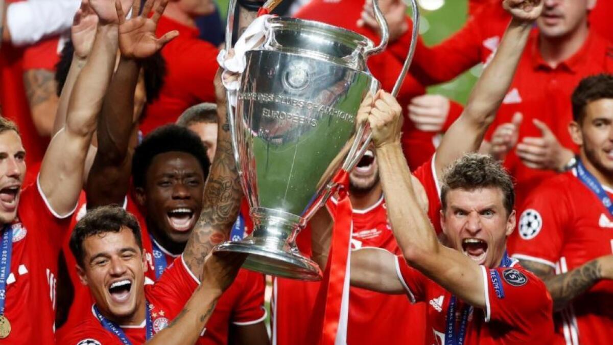Bayern Munich's Thomas Muller and his teammates celebrate with the trophy. (Reuters)