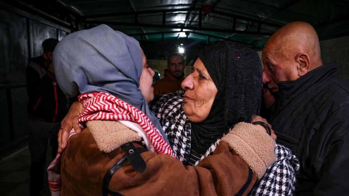 Newly freed Palestinian prisoner Lamees Abu Arqub greets her mother following the release of prisoners from Israeli jails in exchange for Israeli hostages held in Gaza by Hamas since the October 7 attacks (Photo by AFP)