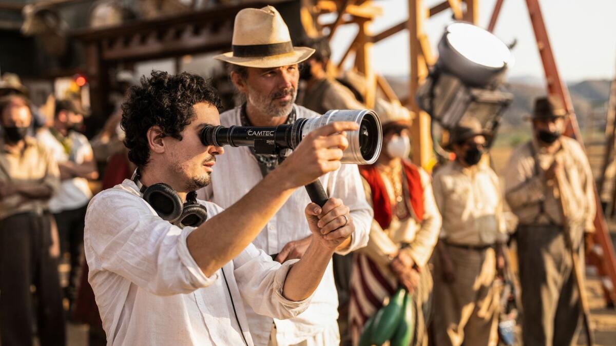 Director Damien Chazelle and director of photography Linus Sandgren on the set of 'Babylon'