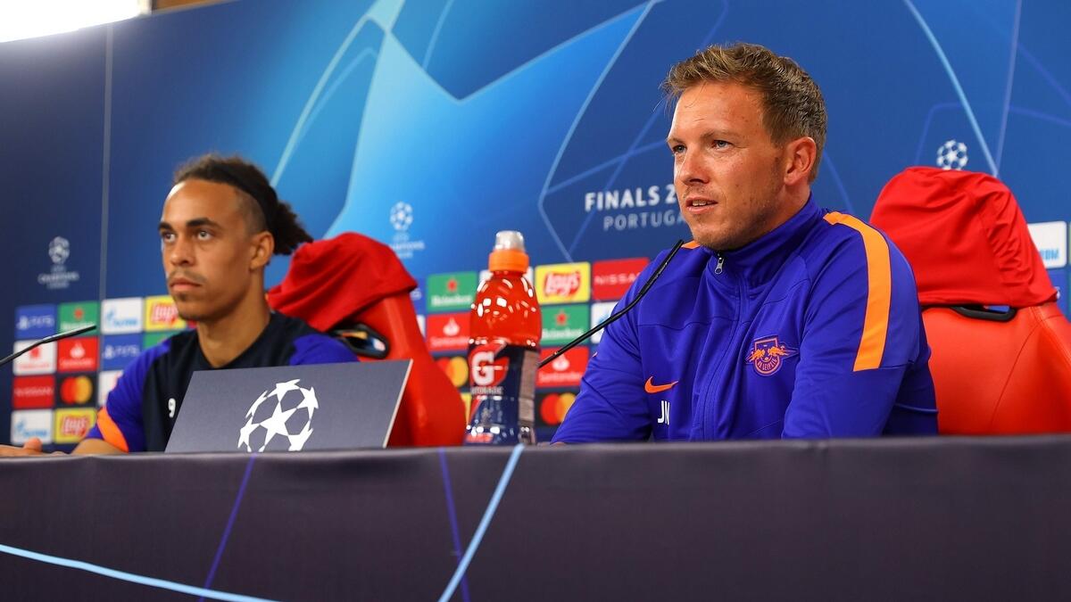 Leipzig's Danish forward Yussuf Poulsen (left) and coach Julian Nagelsmann hold a press conference at the Luz stadium in Lisbon. (AFP)