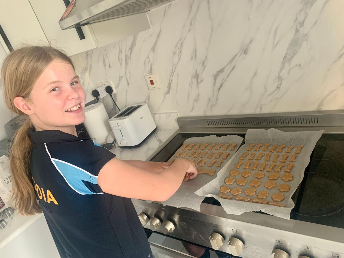 Romilly baking biscuits. Photos: Supplied