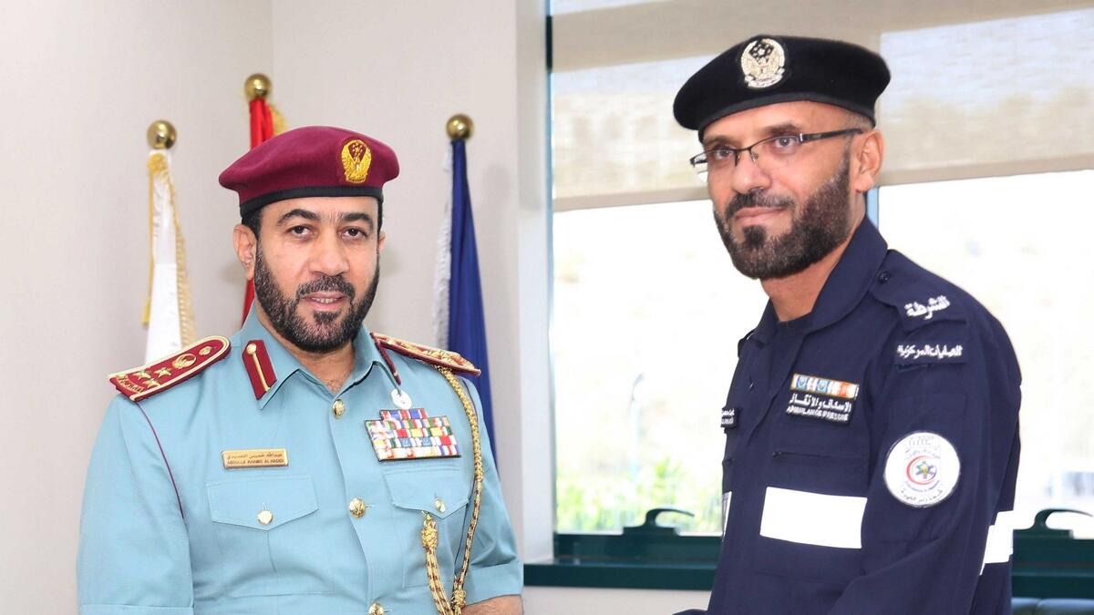 RAK police staff (Sergeant Ali Mohammed Mohsen - right) honoured for rescuing boy from drowning.- Supplied photo