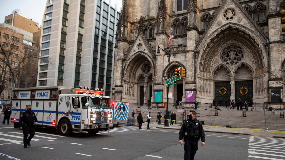 New York police officers block off the scene of a shooting at the Cathedral Church of St. John the Divine, Sunday, Dec. 13, 2020, in New York.  - AP
