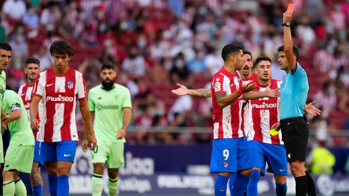 Atletico Madrid's Joao Felix (left) is shown the red card during a Spanish La Liga match against Athletic Bilbao at Wanda Metropolitano stadium. — AP