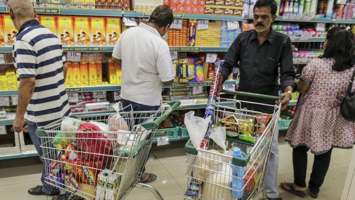Shopping carts containing goods sit as shoppers browse at a D-Mart supermarket operated by Avenue Supermarts Ltd. in Thane, Maharashtra, India, on Saturday, Feb. 13, 2016. India's D-Mart supermarkets, which have managed to turn a profit in each of the last 15 years, makes money from giving customers fewer choices of no-frills products, enabling it to negotiate better prices with vendors, and by refusing to spend money on analytics, loyalty programs, social media or any other new-fangled strategies. Photographer: Dhiraj Singh/Bloomberg