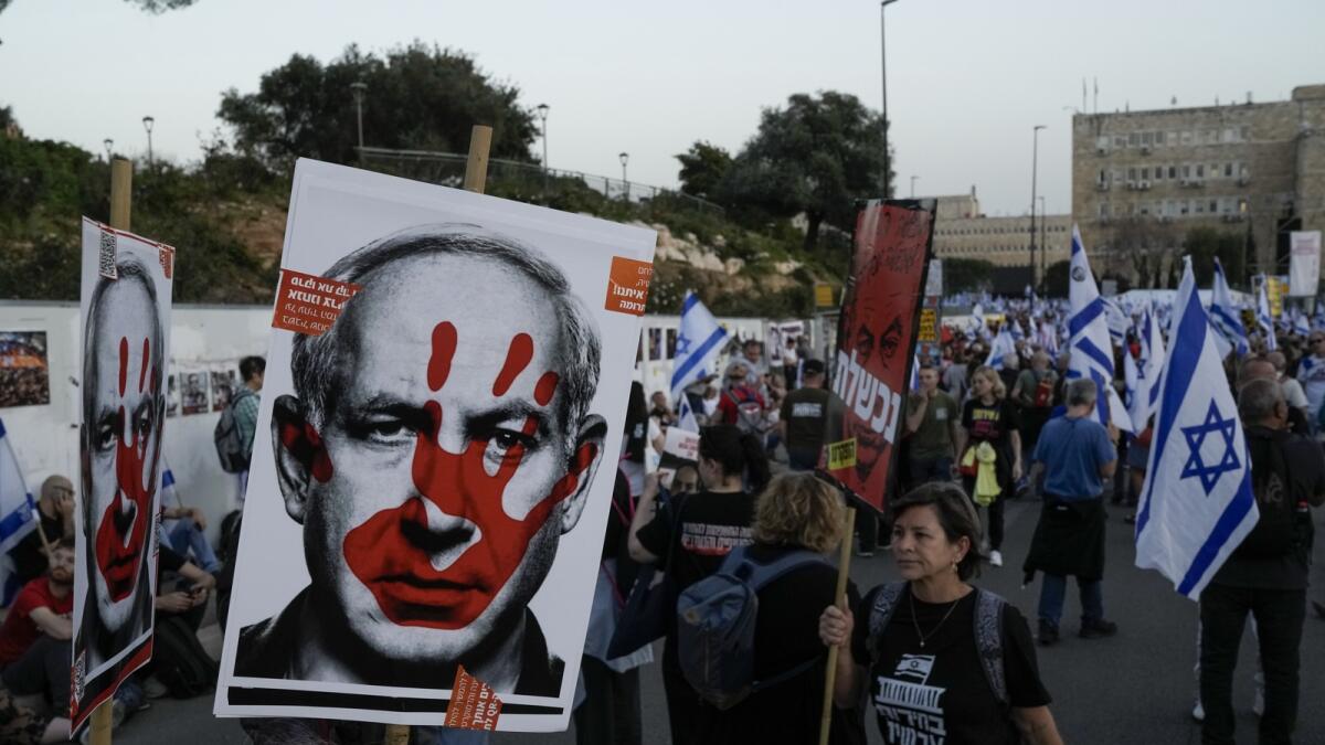 People take part in a protest against Benjamin Netanyahu's government outside the Knesset in Jerusalem. — AP