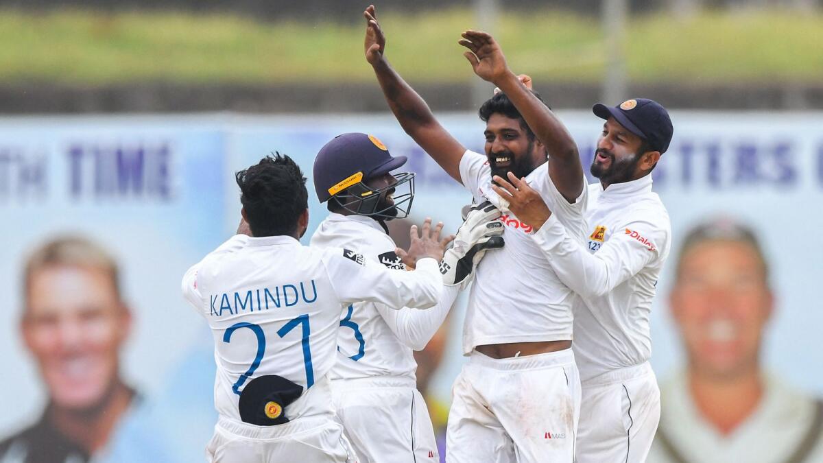 Sri Lanka's Prabath Jayasuriya (second right) celebrates with teammates after taking the wicket of Australia's Marnus Labuschagne. (AFP)