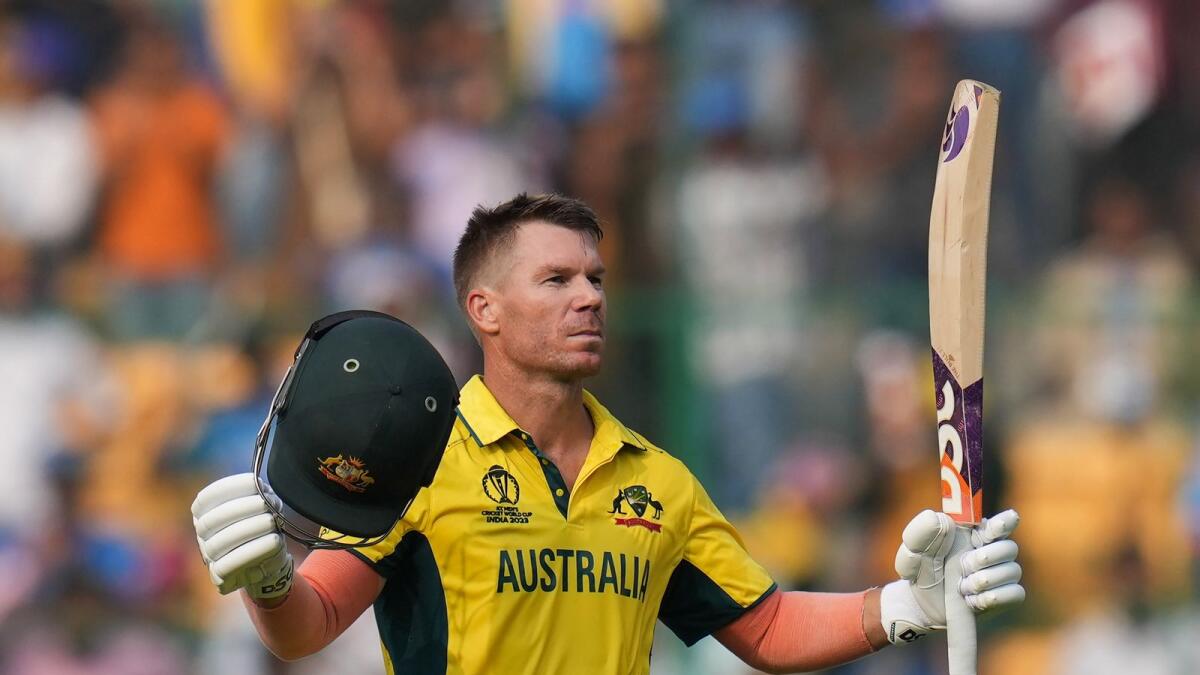 David Warner celebrates his century during the ICC World Cup 2023 match between Pakistan and Australia in Bengaluru. — PTI