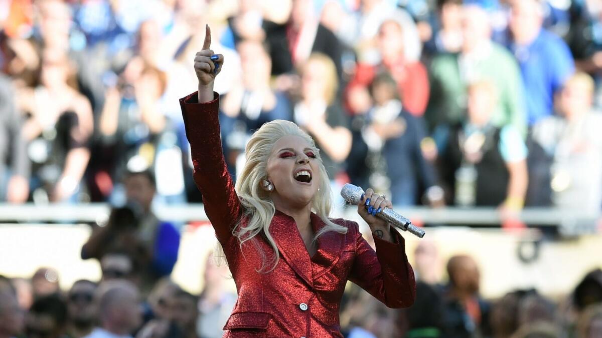 Lady Gaga performs the American National Anthem prior to the start of Super Bowl 50 between the Carolina Panthers and the Denver Broncos at Levi's Stadium in Santa Clara, California, February 7, 2016. / AFP / TIMOTHY A. CLARY