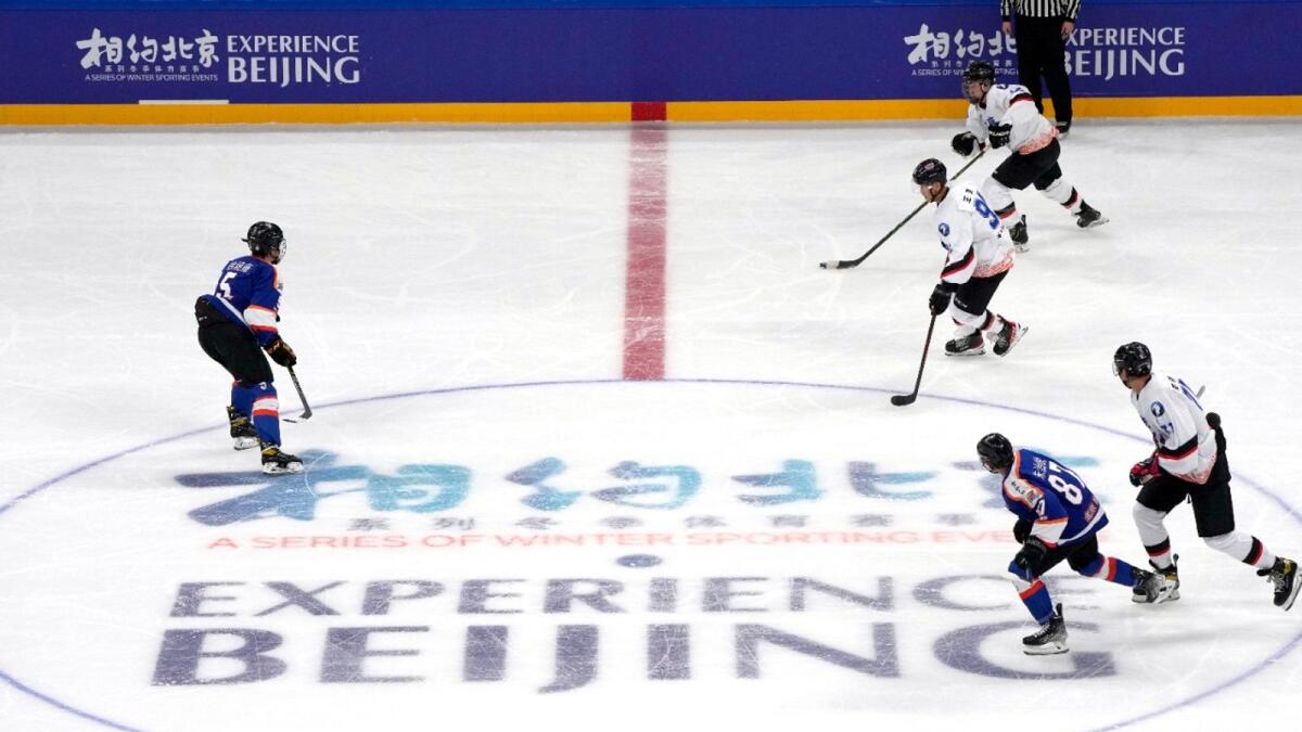 Players compete during a match between the Beijing Arcfox and the Beijing Shougang Eagles in the Experience Beijing Ice Hockey Test Activity, a test event for the 2022 Beijing Winter Olympics, at the Wukesong Sports Center on Monday. (AP)