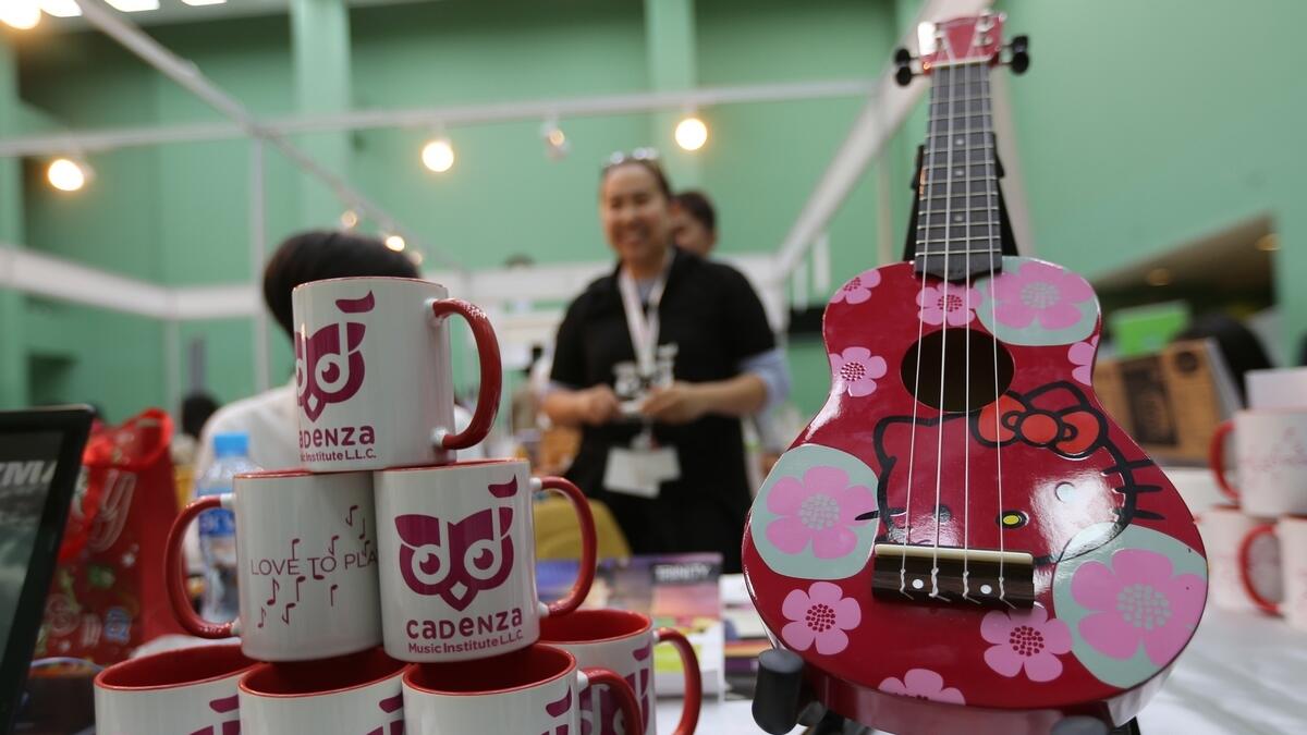 A visitor looks at customised mugs and musical instruments in a stall at the India Social and Cultural Centre.