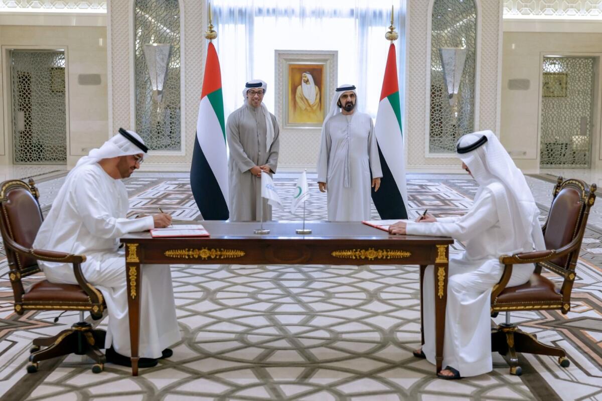The signing of an agreement between Dewa and Masdar. Photo: DMO