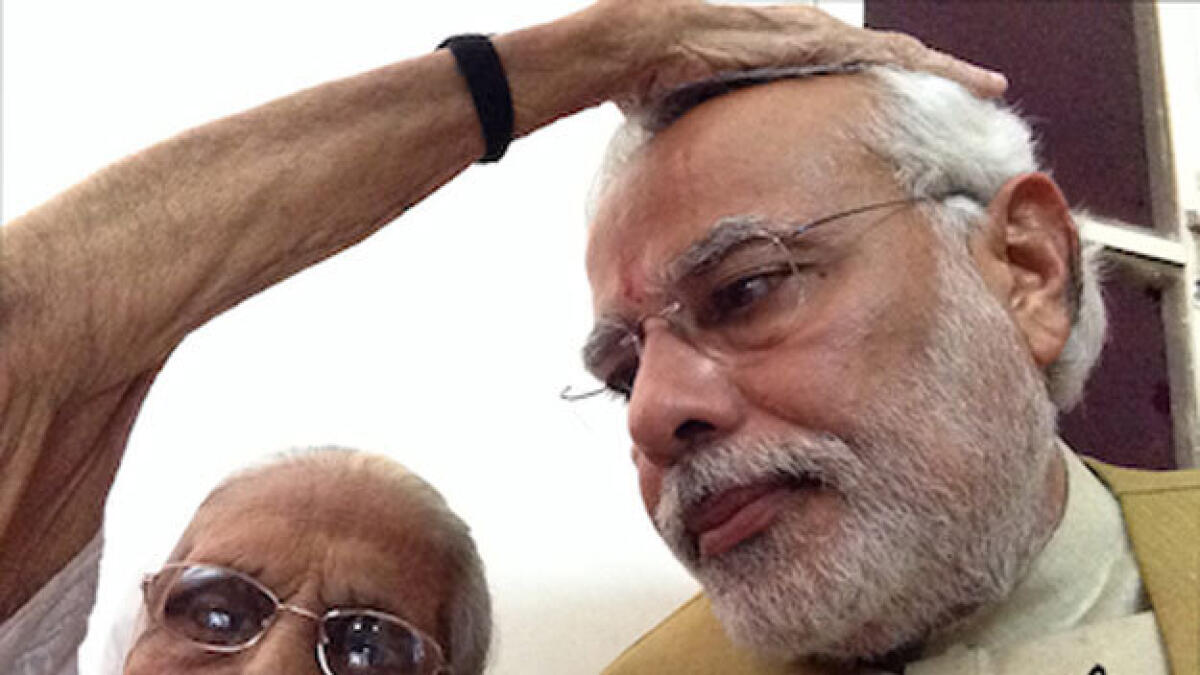 Modi shares self autographed picture with his mother