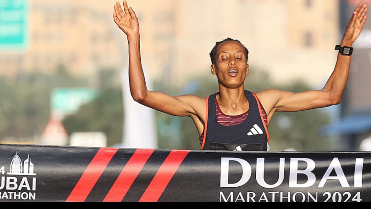 Tigist Ketema celebrates after reaching the finish line in Dubai on Sunday. — Dubai Marathon