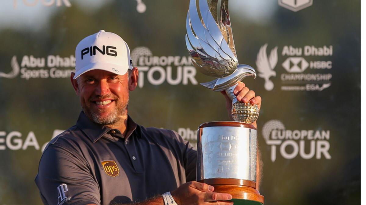 Lee Westwood of England poses with the trophy after winning the 2020 Abu Dhabi HSBC Golf Championship. — AFP