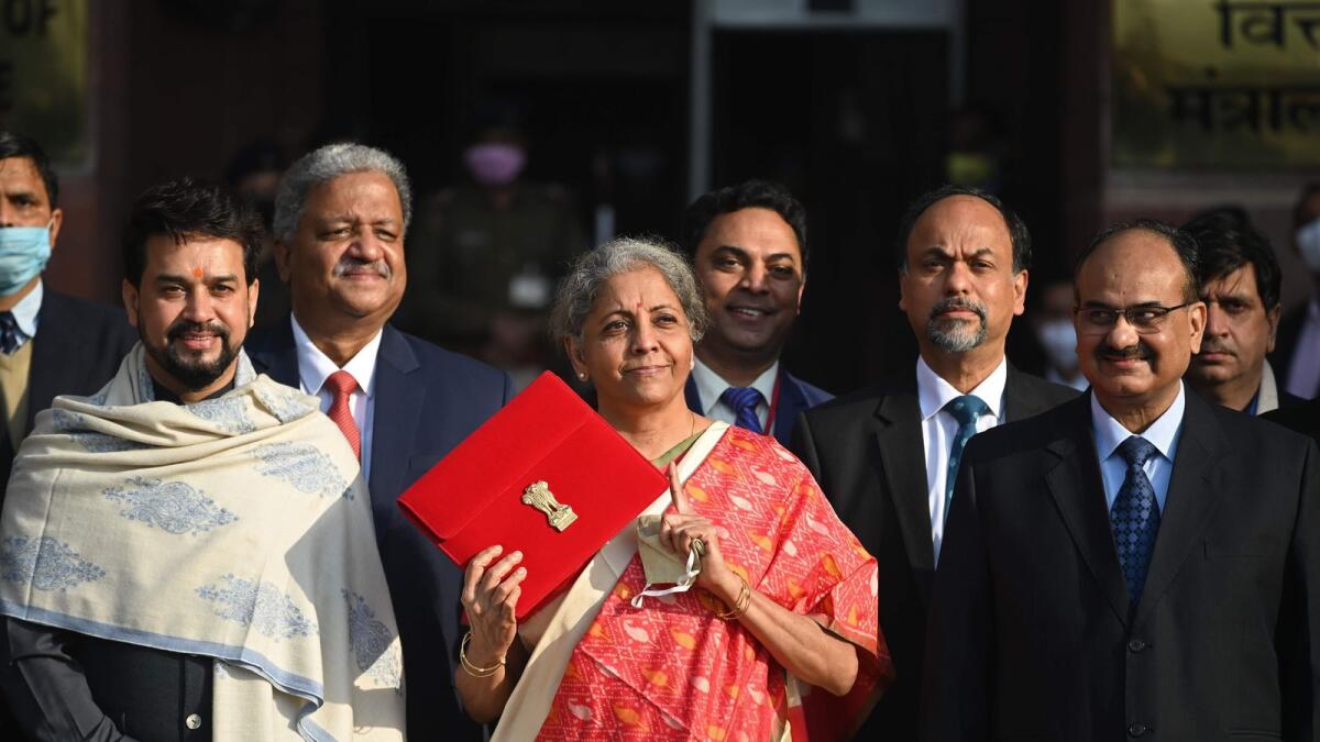 India's Finance Minister Nirmala Sitharaman (C) along with her staff leaves the Finance Ministry to present the annual budget in parliament in New Delhi. Photo: AFP