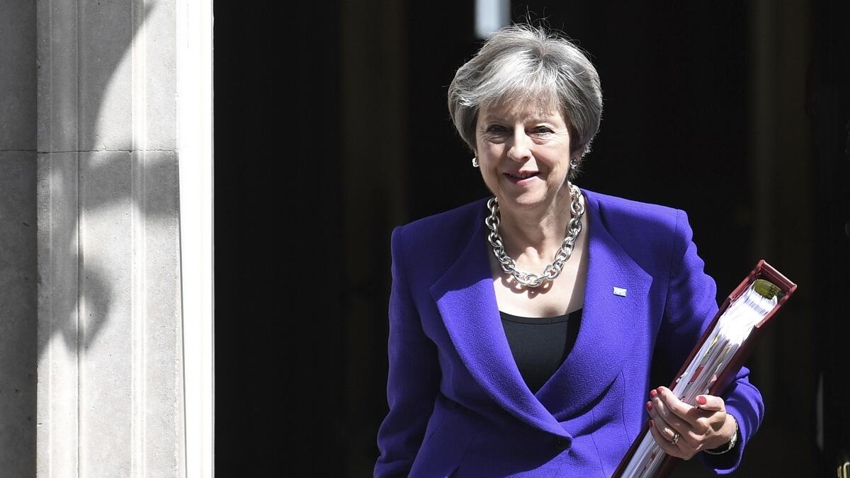 Britains Prime Minister Theresa May leaves 10 Downing Street in London.-AP