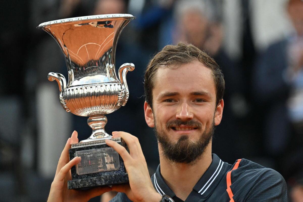 Russia's Daniil Medvedev celebrates with the Rome Open trophy after  he defeated  Foro Italico on Sunday.  AFP