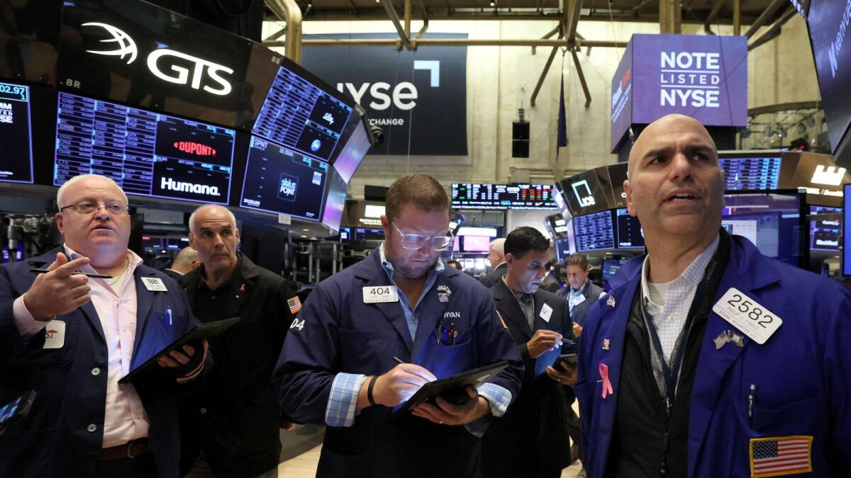 Traders work on the floor of the New York Stock Exchange. — Reuters