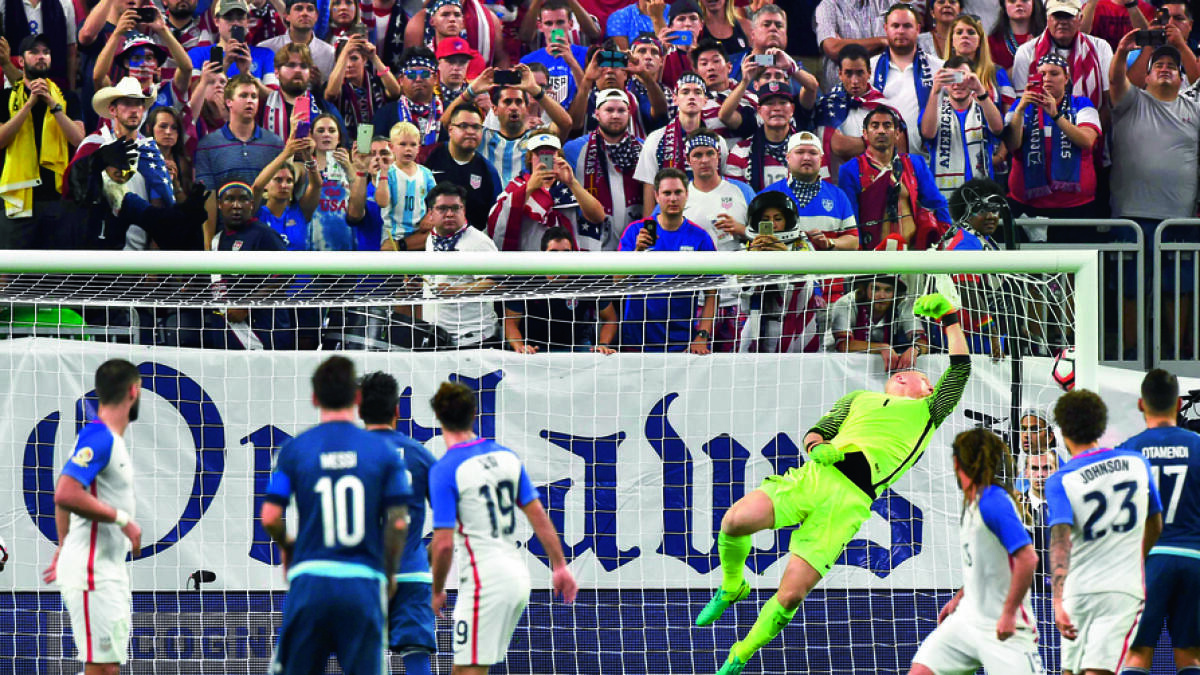 Lionel Messi scores a free-kick past US goalkeeper Brad Guzan during their Copa America Centenario semifinal in Houston. — AFP