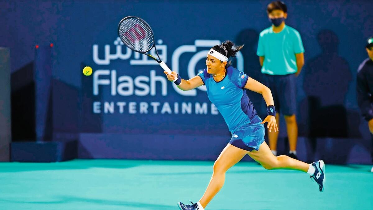 Arab flag bearer: Tunisia’s Ons Jabeur plays a shot during her match against Belinda Bencic in the Mubadala World Tennis Championship in Abu Dhabi on Thursday night. — Supplied photo