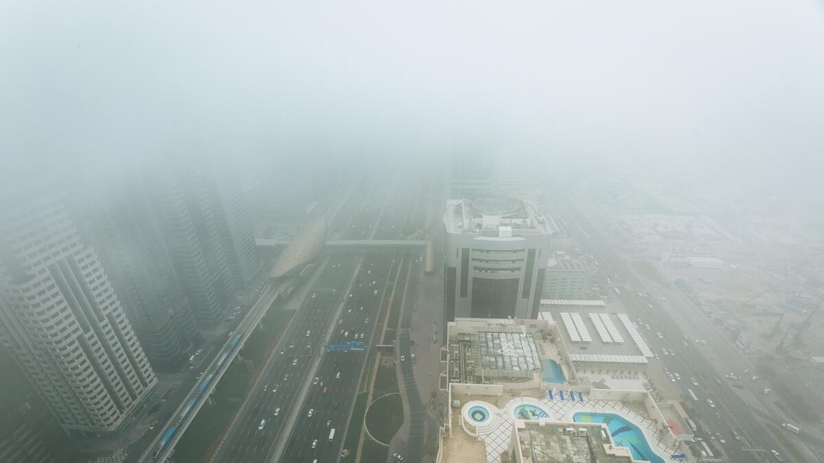 Dense fog rolls over Sheikh Zayed road as seen from Level 43 of Four Points by Sheraton, Dubai.- Photo by Neeraj Murali/ Khaleej Times 