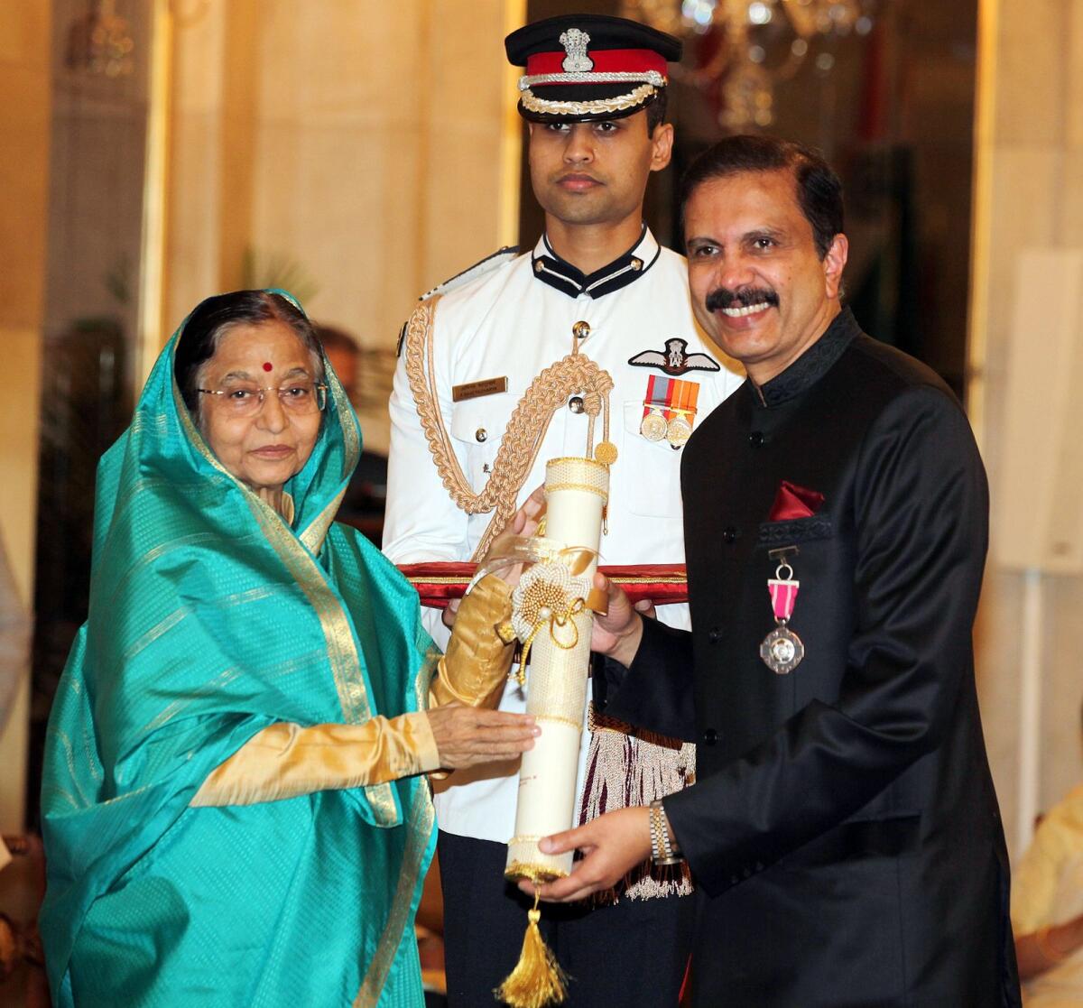 Dr Azad Moopen receiving the Padma Sri Award from President of India