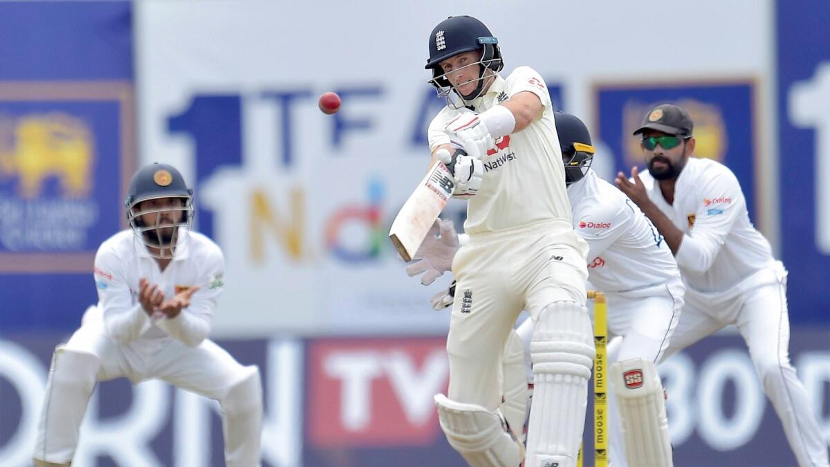 Joe Root plays a shot during the first Test against  Sri Lanka and England at Galle. — PTI
