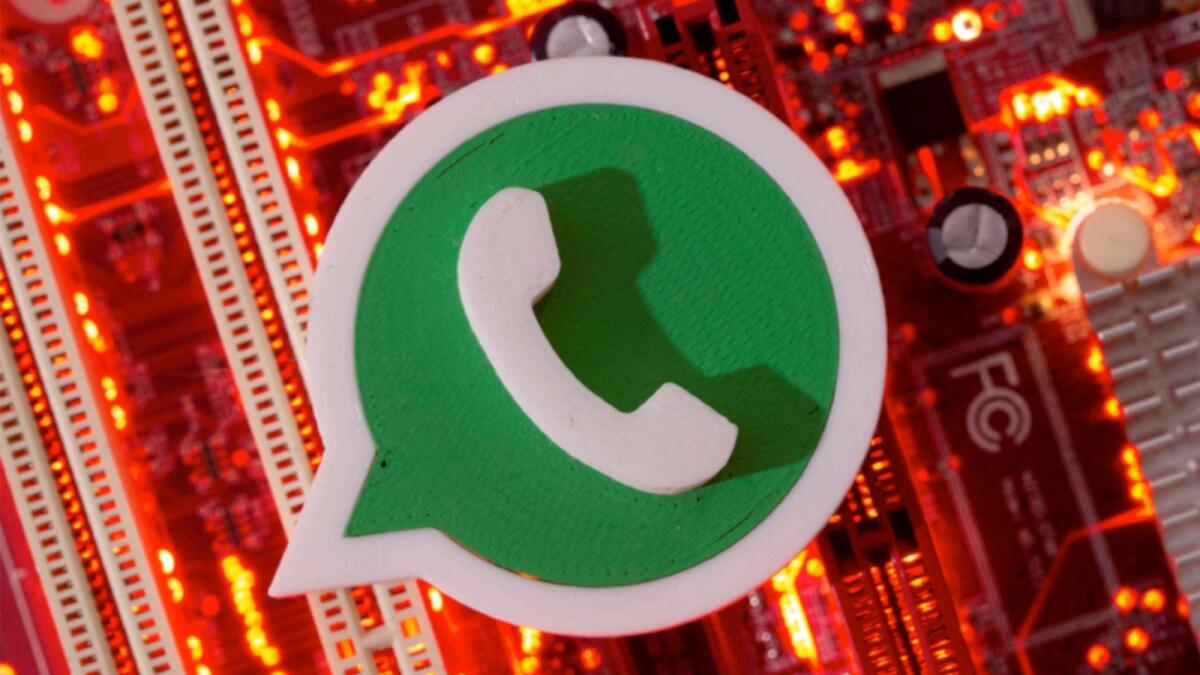A 3D-printed WhatsApp logo is placed on a computer motherboard. — Reuters