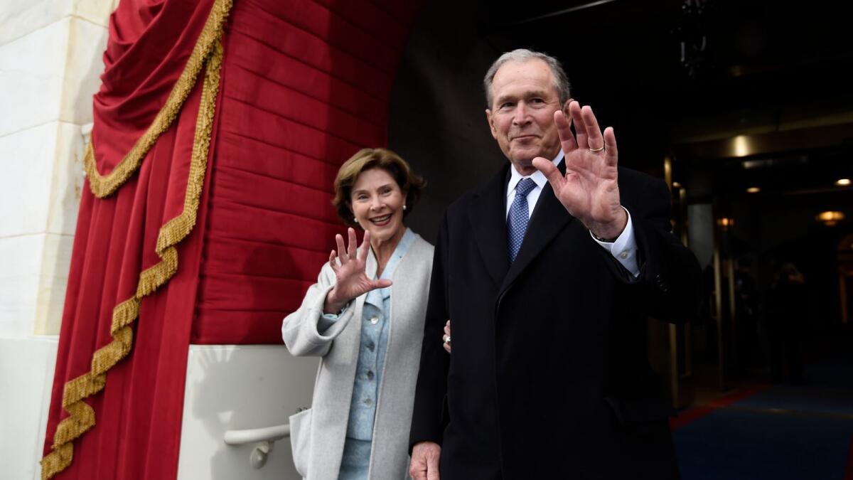 Former US President George W. Bush seen with First Lady Laura Bush.