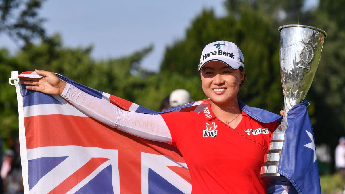 Minjee Lee from Australia poses with the trophy after winning the Amundi Evian Championship in the French Alps town of Evian-les-Bains. — AFP