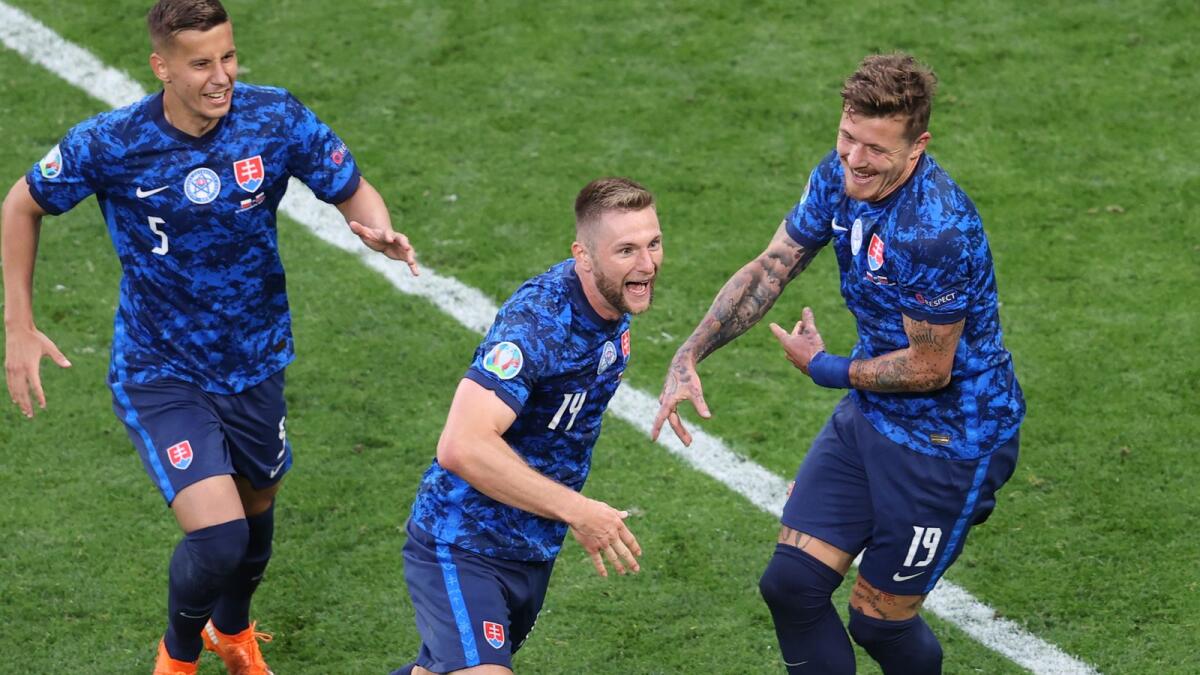 Slovakia's Milan Skriniar (centre) celebrates after scoring a goal during the Euro 2020 championship group E match between Poland and Slovakia. — AP
