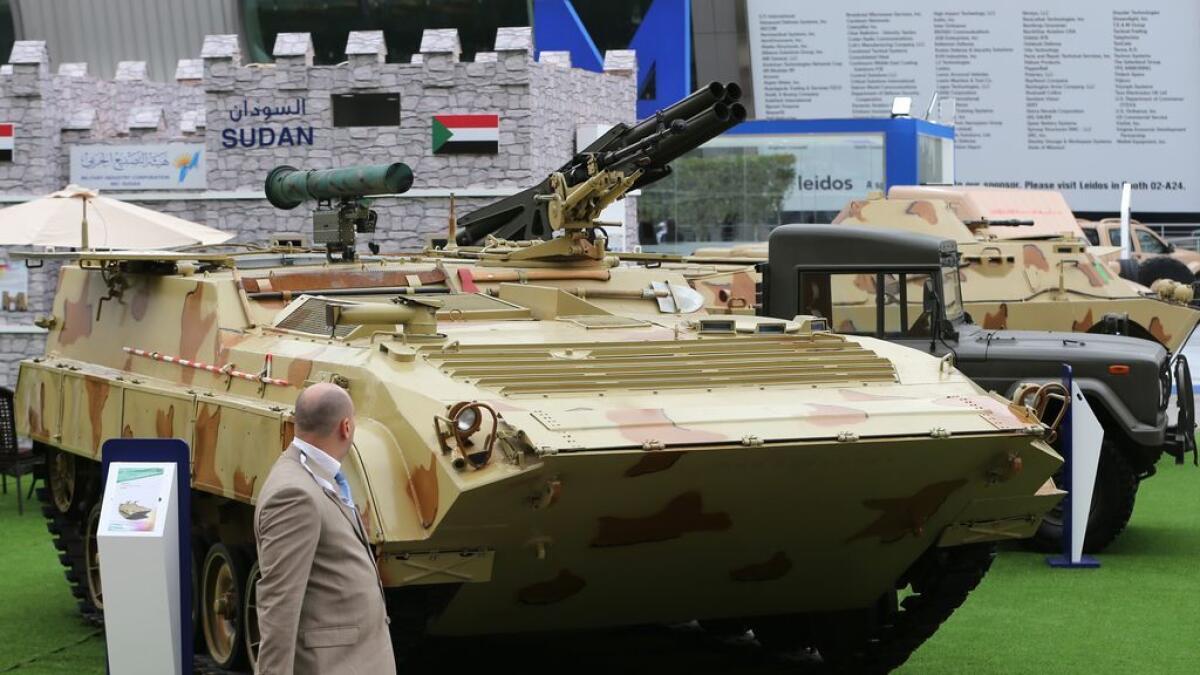  Visitors view the Khatim-4 Armored Missile Launcher on display at the Sudan Pavilion on the 3rd day of International Defense Exhibition and Conference held at ADNEC Exhibition Center in Abu Dhabi. 