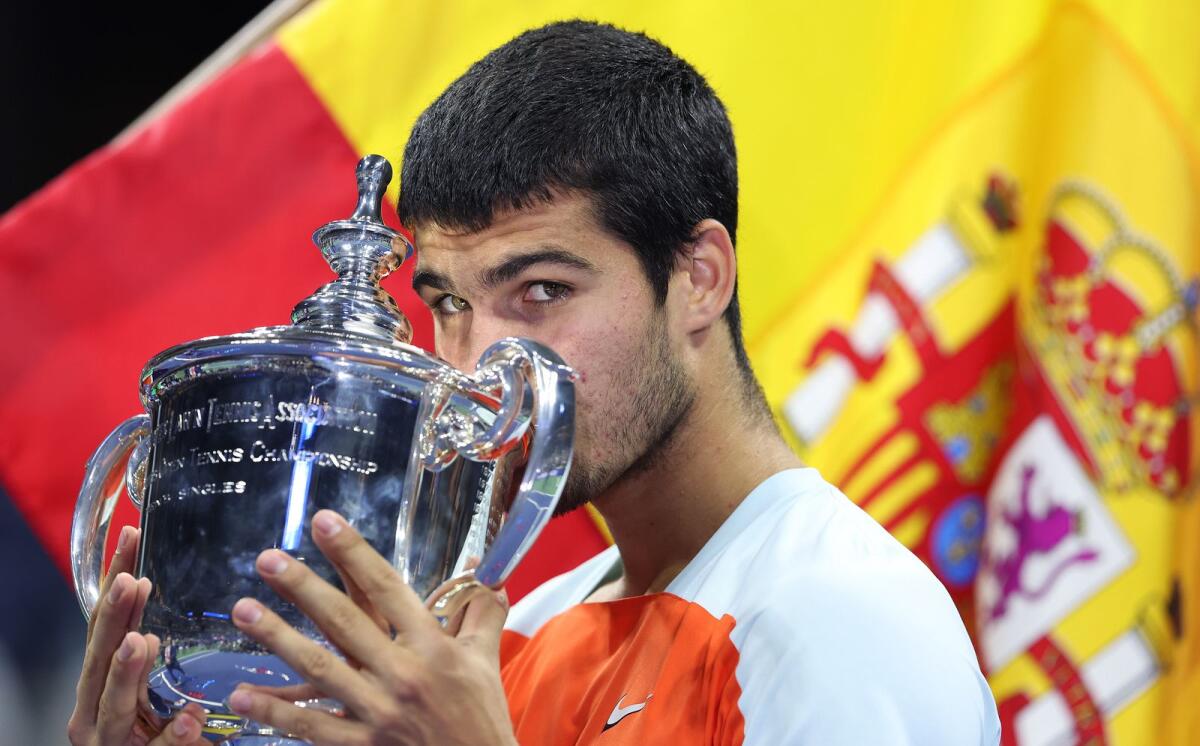 Carlos Alcaraz of Spain celebrates with the winner's trophy after defeating Casper Ruud of Norway in the US Open final last month. (AFP)