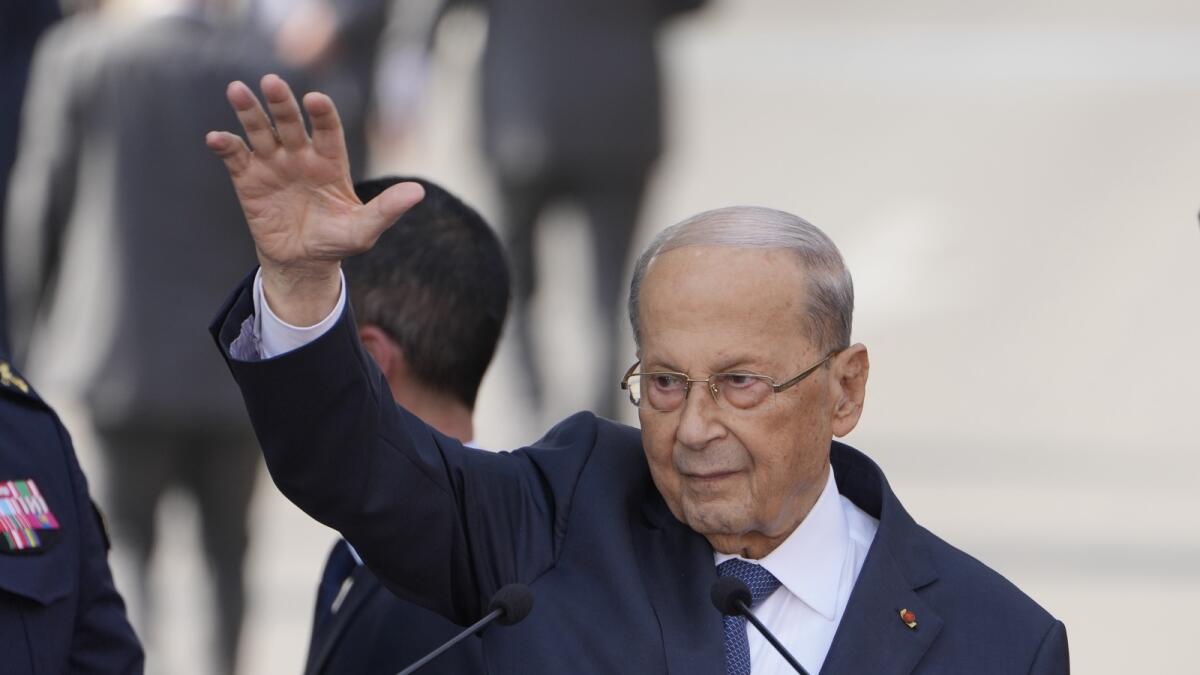 Lebanese President Michel Aoun waves for his supporters during a speech to his supporters gathered outside the presidential palace in Baabda, east of Beirut, Lebanon, on October 30, 2022. — AP file