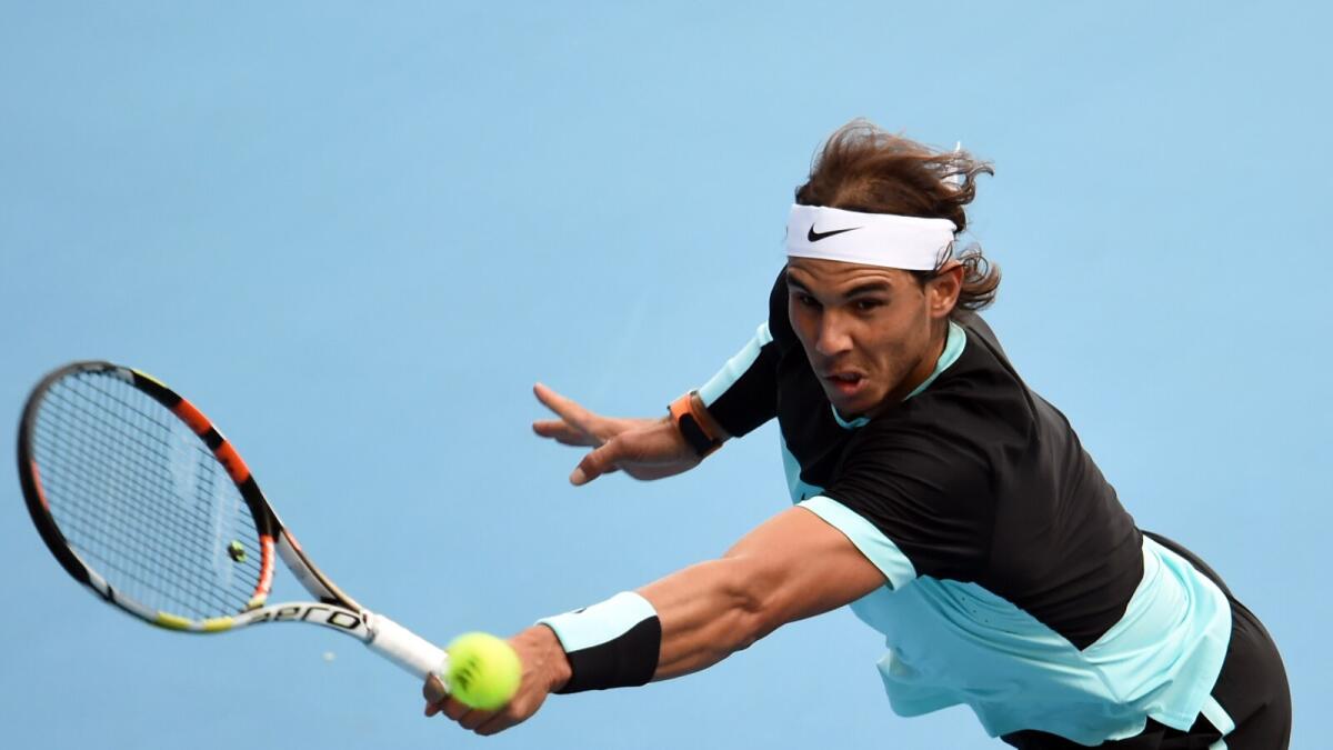 Rafael Nadal of Spain hits a return against Jack Sock of the US during their quarter-final men's singles match at the China Open tennis tournament in Beijing on October 9, 2015. AFP PHOTO / GOH CHAI HIN