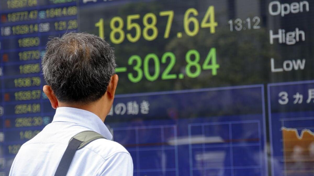 Asian shares fall on bleak China manufacturing data 