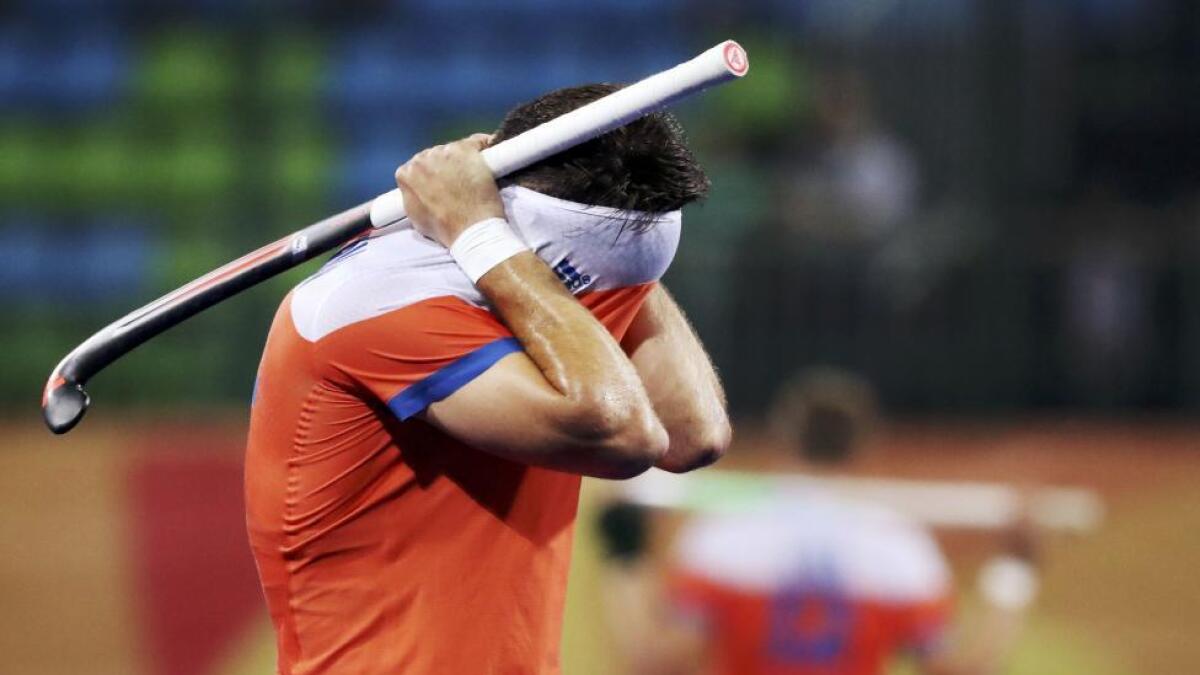 Robbert Kemperman of Netherlands reacts after his team's loss to Belgium in the men's field hockey semifinal. Reuters