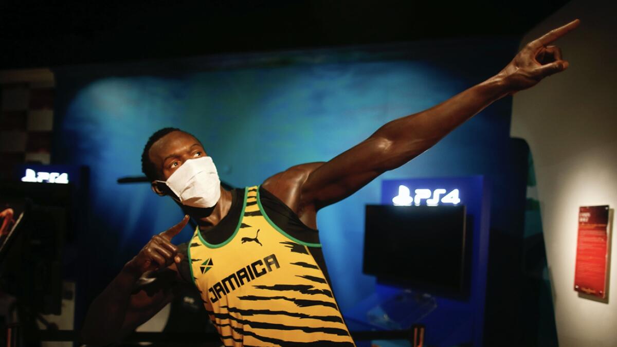 In order to raise awareness against the spread of the coronavirus, a mask is placed on the wax figure of Jamaica's Usain Bolt at Madame Tussauds attraction in Istanbul, Saturday, July 11, 2020. Turkish authorities have made the wearing of masks mandatory in most of the country to curb the spread of Covid-19 following an uptick in confirmed cases since the reopening of many businesses. AP