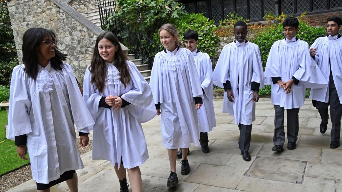 Members of the King's Scholars of Westminster School try on formal robing ahead of their 'Vivat Rex' proclamation for King Charles III at his upcoming coronation, at Westminster School in London, Britain, on April 21, 2023. — Reuters