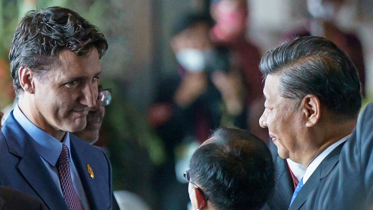 Canada's Prime Minister Justin Trudeau speaks with China's President Xi Jinping at the G20 Leaders' Summit in Bali. — Reuters