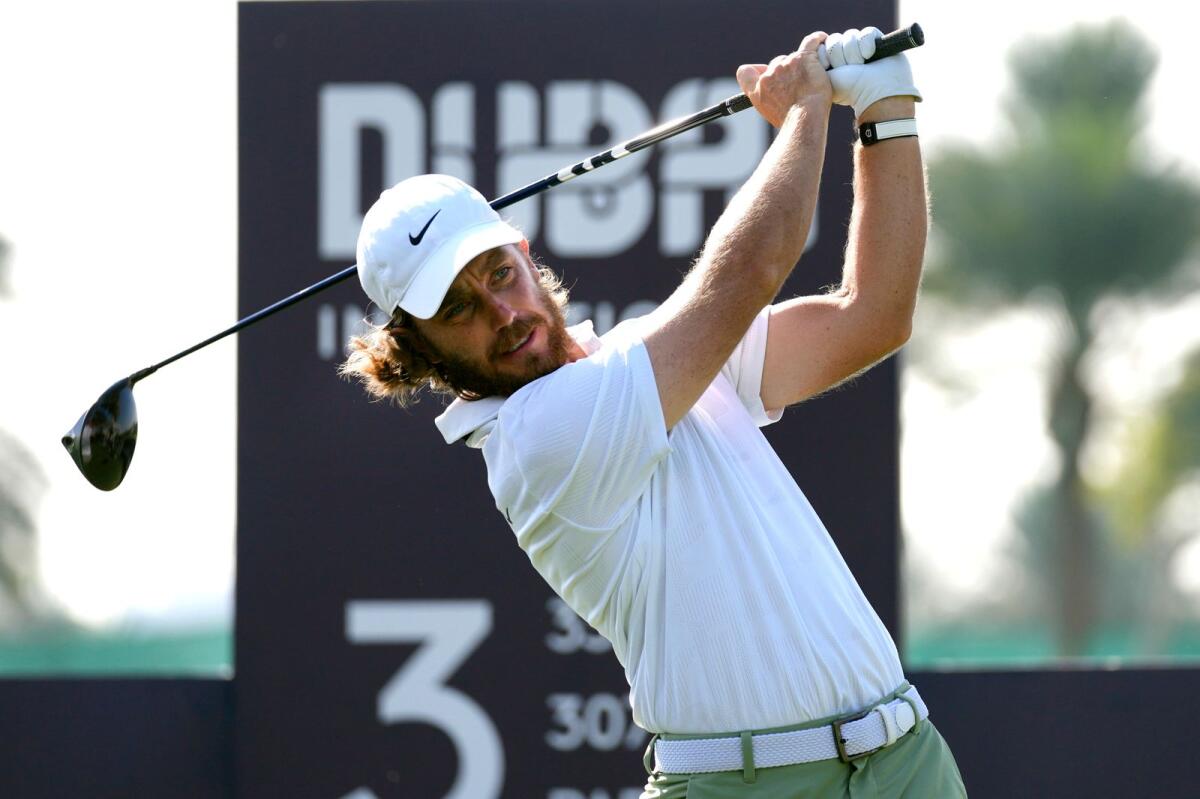 Tommy Fleetwood of England tees off on the third hole during the third round of Dubai Invitational golf tournament, in Dubai. - AP
