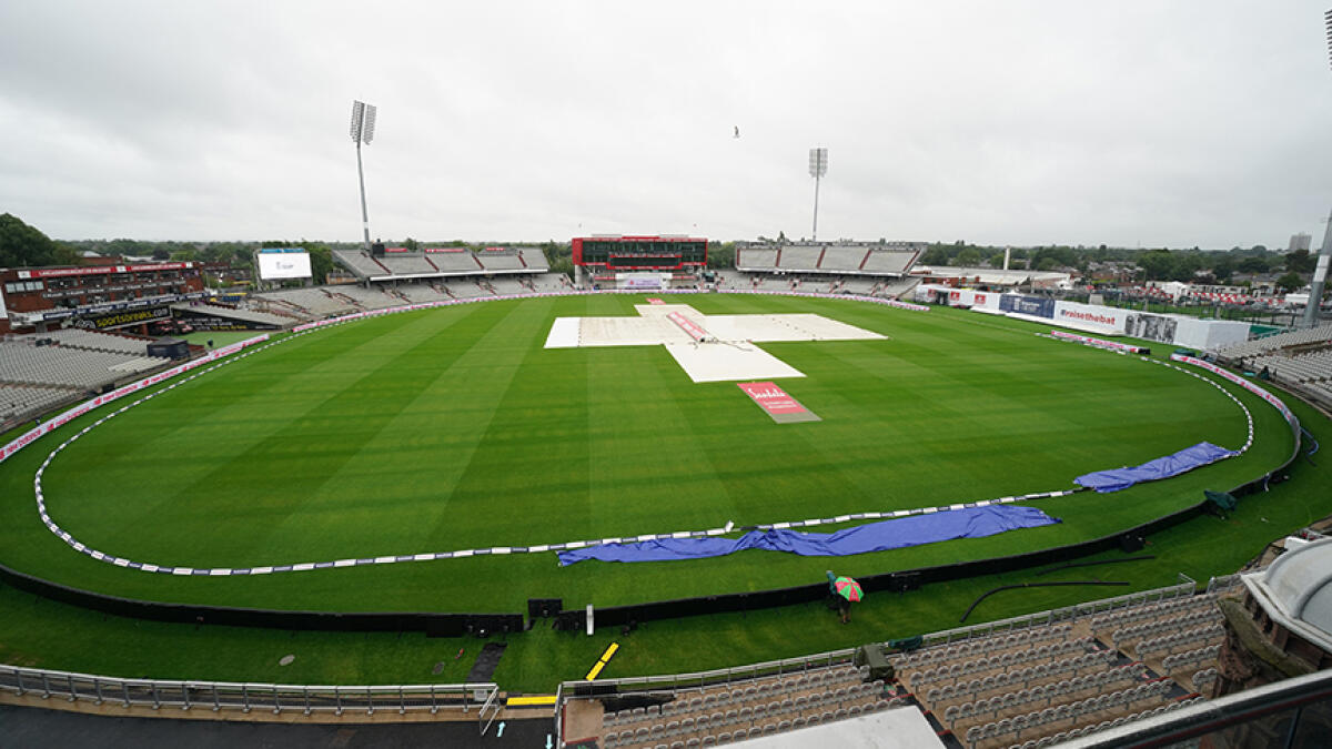 Covers are on as rain delays start of play on the third day of the second Test cricket match between England and the West Indies at Old Trafford in Manchester on Saturday. -- AFP