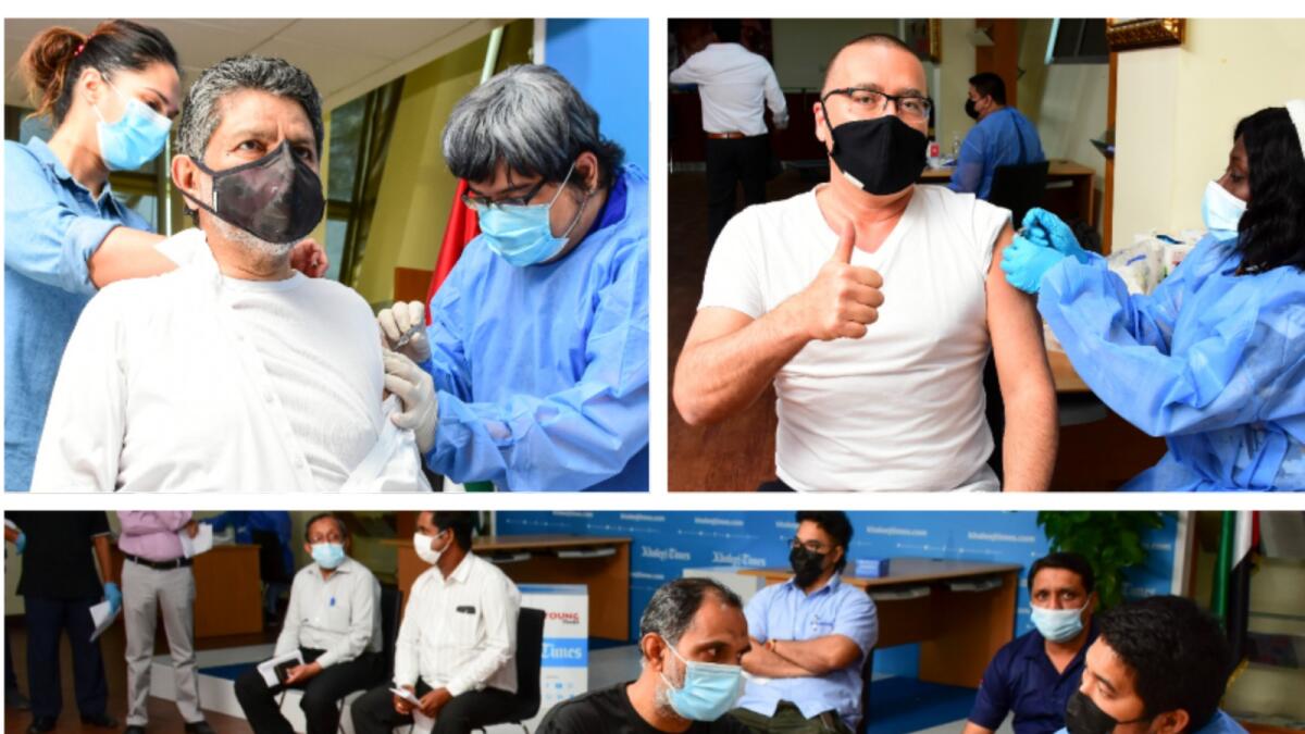 Mohamed Yahya Kazi and Axel Dreyer were among the first to get the jab at the vaccination drive held at the KT head office.  — Photos by Shihab