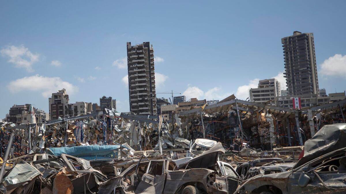 Damaged cars remain at the site of the Aug. 4 deadly blast in the port of Beirut that killed scores and wounded thousand. AP