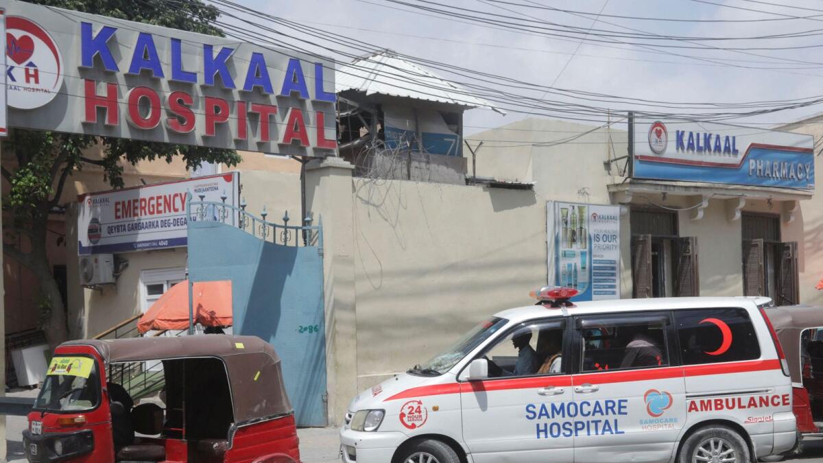 A Somacare ambulance carrying an unidentified wounded person drives into the Kalkaal hospital after Al Shabaab militants attacked Villa Rose hotel, in Mogadishu. — Reuters