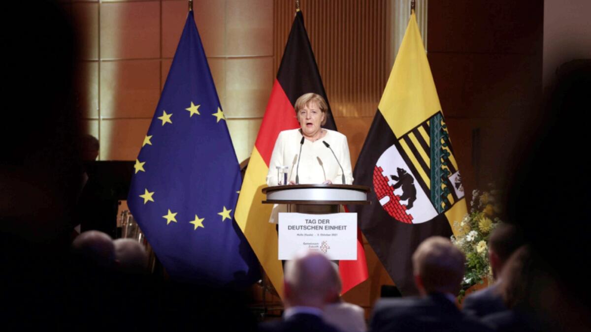Chancellor Angela Merkel (CDU) speaks at the ceremony marking German Unity Day. — AP